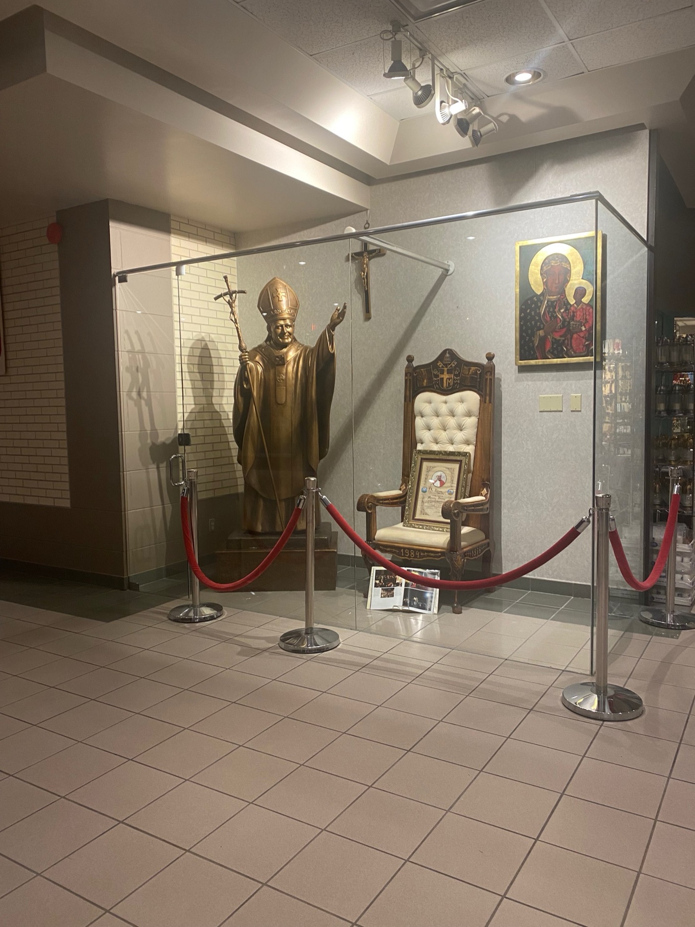 John Paul II statue and commemorative display inside the Polish Cultural Centre
