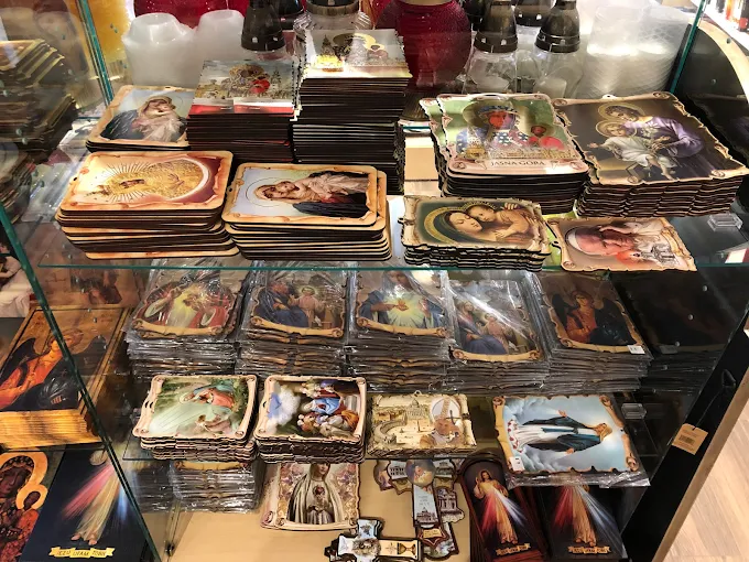 Devotional plaques and Catholic gifts displayed at Vaticano Catholic Store